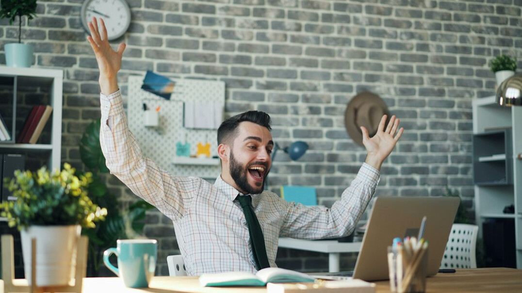 office worker stretching at desk